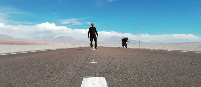 A wide landscape along an independent travel route, representing movement, distance and open road travel